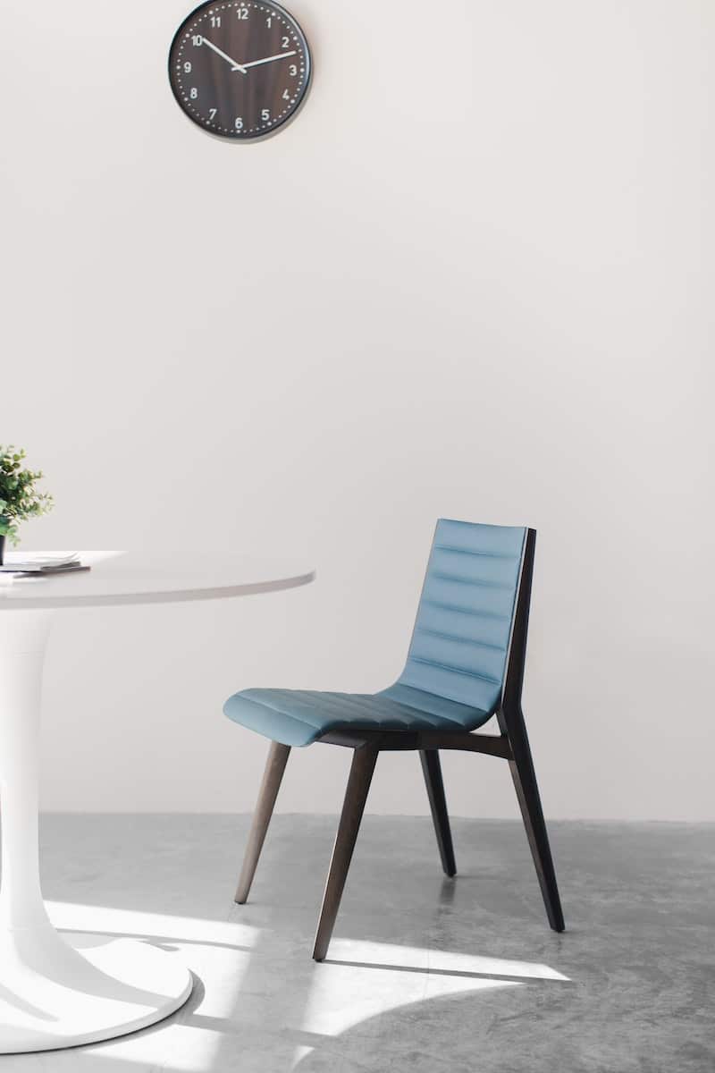 blue wooden chair beside white table